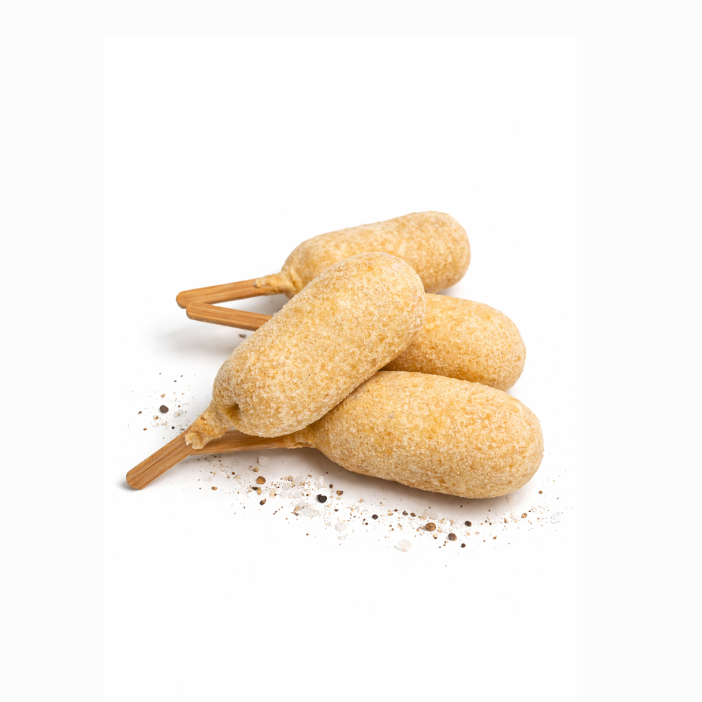 Three bread sticks with a cinnamon stick on a white background